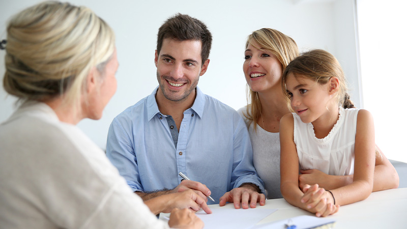 A family meeting a real estate agent