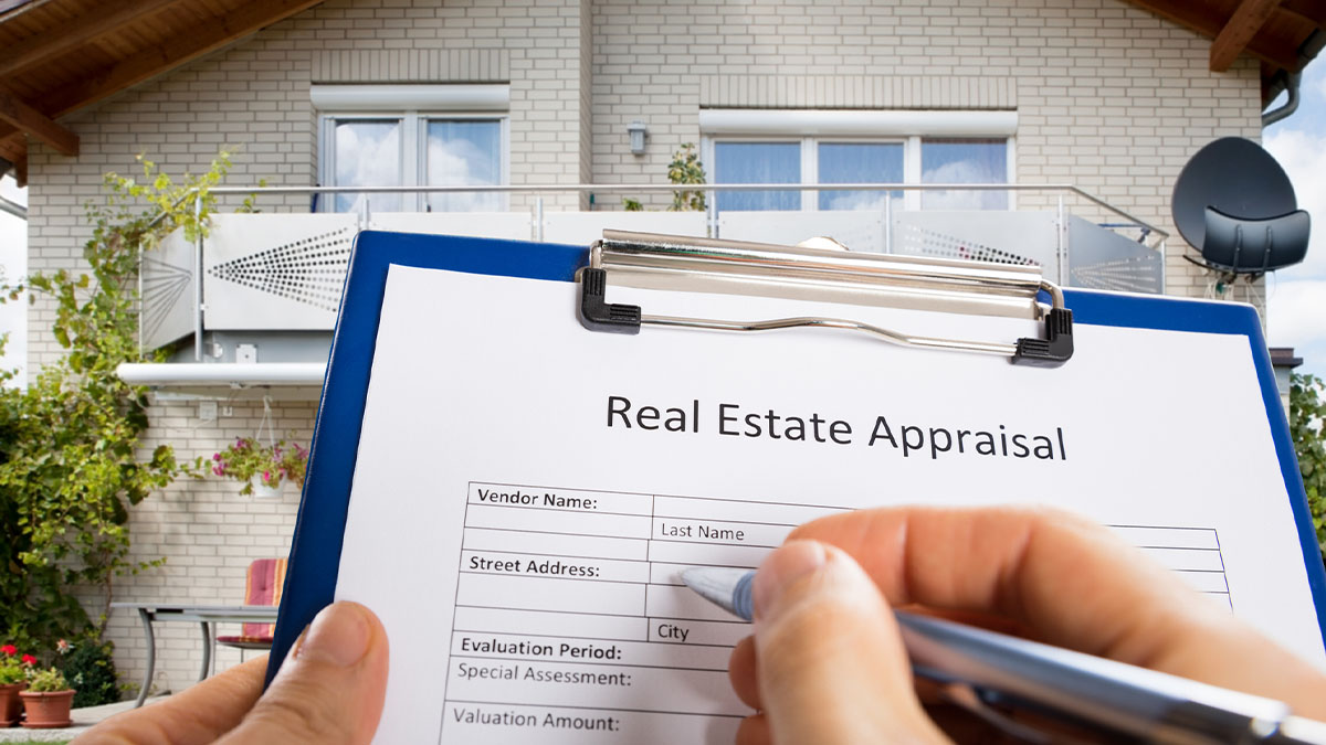 An appraiser looking at a house for appraisal