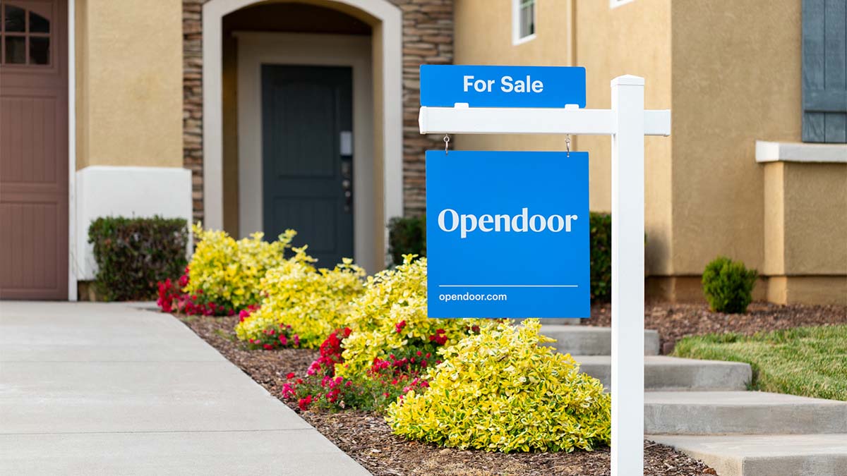 Image of opendoor sign in front of house