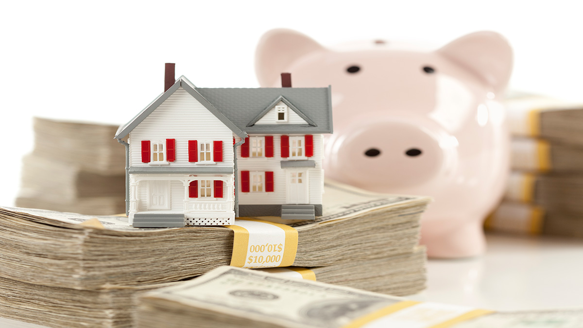 Image of Small house and money with piggybank