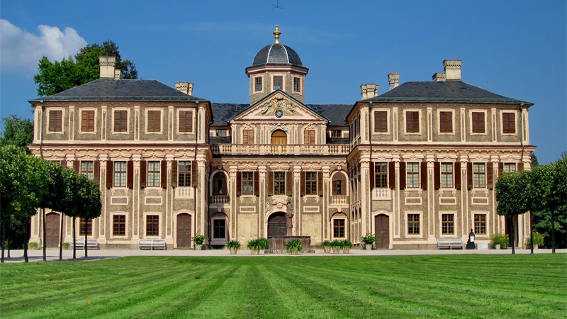 A huge mansion with a massive frontyard