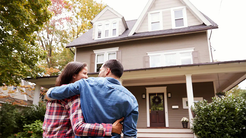 Image of couple happy with house